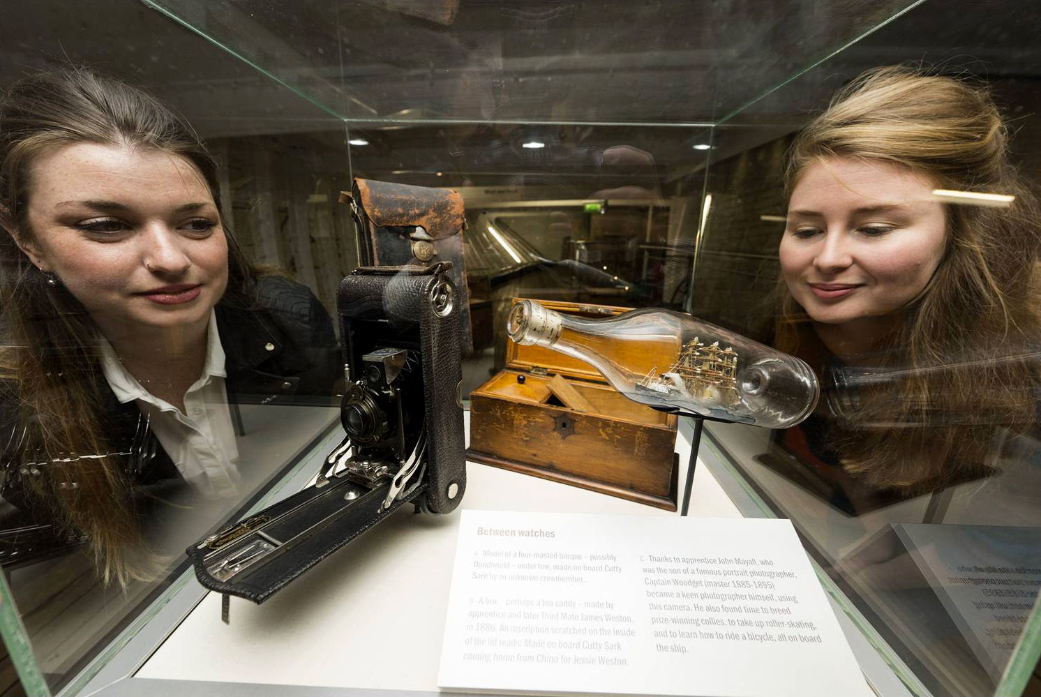 Conservators Liz Ralph and Rachel Morley view artefacts on display inside the Cutty Sark on private tour. Photo by Ray Tang